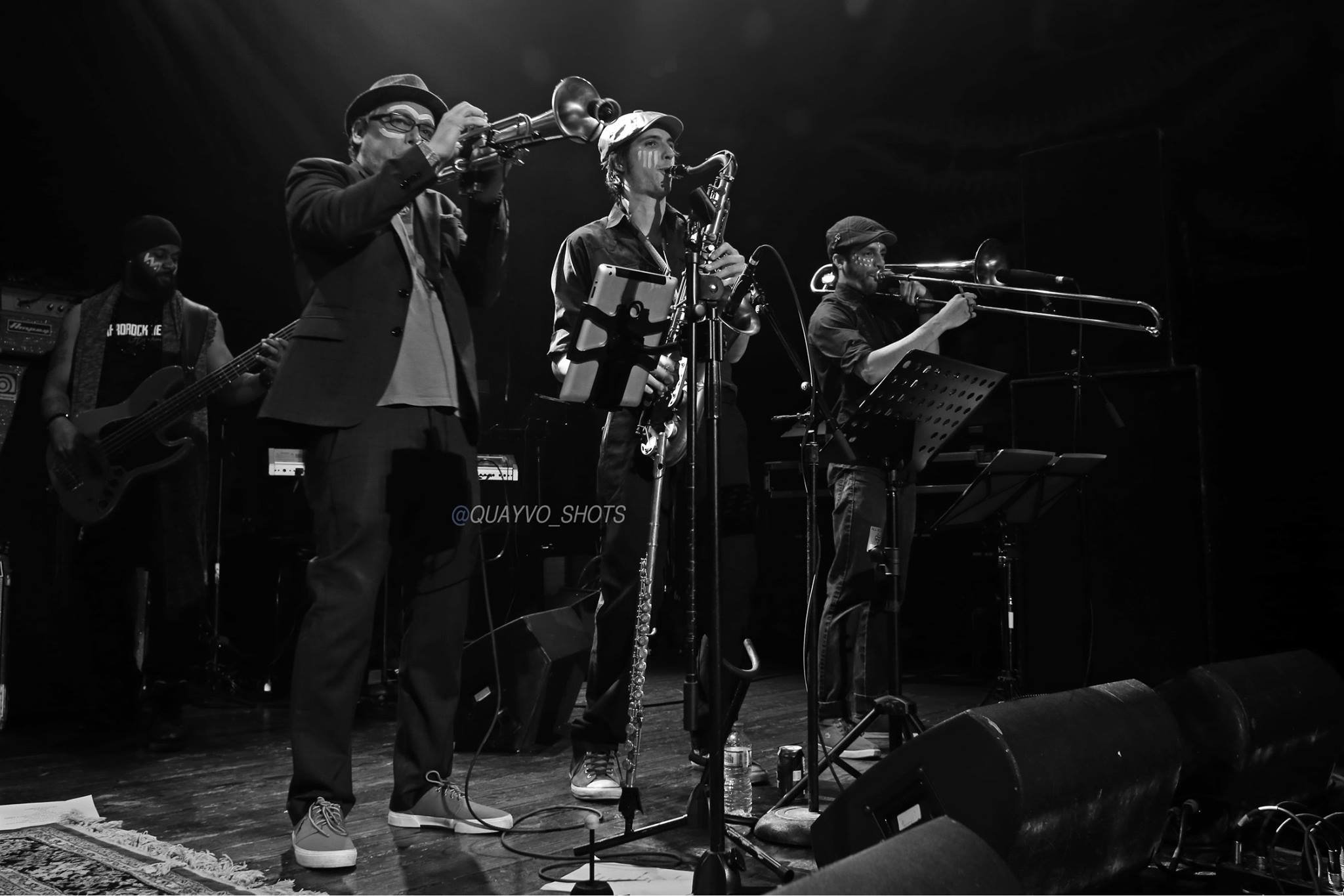 A horn section playing on stage